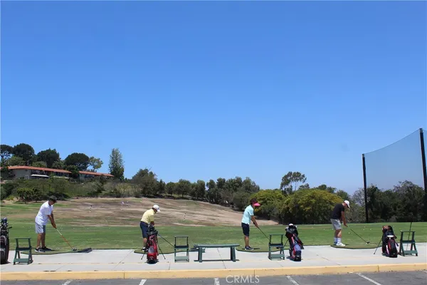 a view of a deck with furniture and a yard