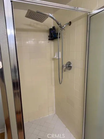 a bedroom with a bed and dresser