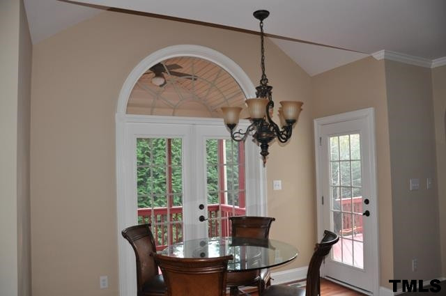 4019 Fenn Brook Lane Raleigh, NC 27613 - Photo 9 of 25 Inviting breakfast area adjoins kitchen to screen porch and deck. Beautiful half-round window in vaulted ceiling brings in light and view! Breakfast Area
