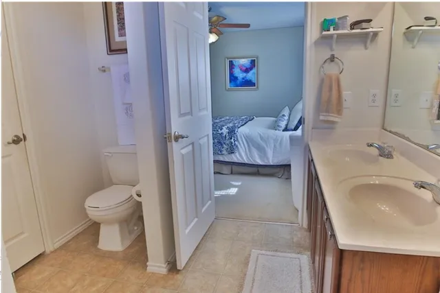 a bedroom with a bed and a mirror