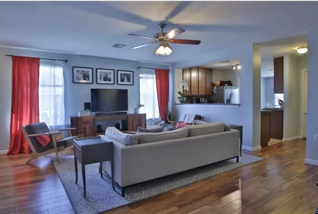 a view of a dining room with furniture window and wooden floor