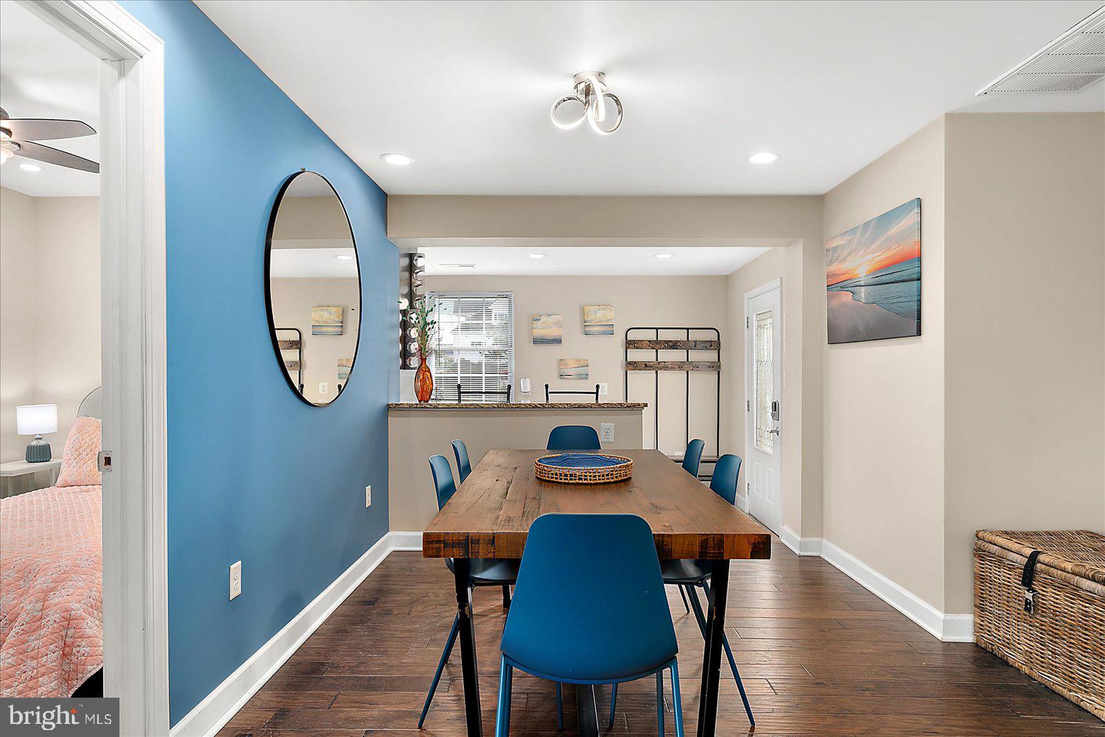 10428 Exeter Road Ocean City, MD 21842 - Photo 16 of 56 a dining room with furniture a rug and a mirror