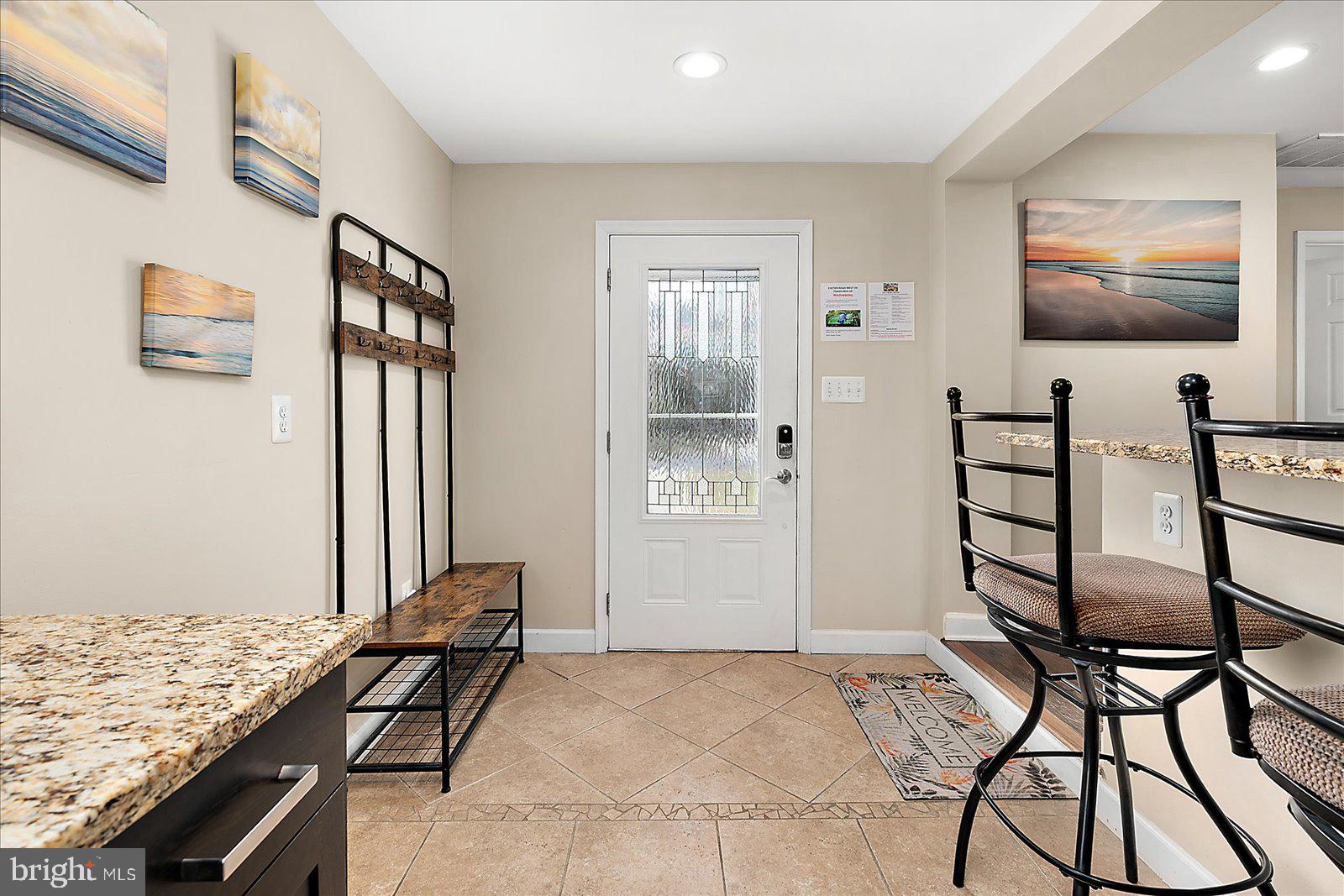 10428 Exeter Road Ocean City, MD 21842 - Photo 21 of 56 a bedroom with furniture and flat screen tv