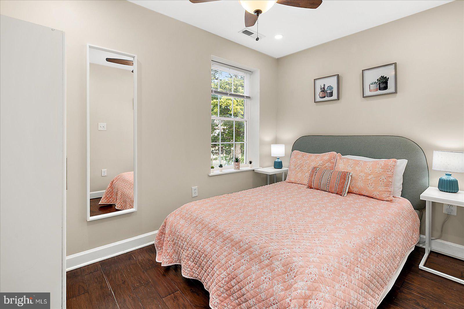 10428 Exeter Road Ocean City, MD 21842 - Photo 29 of 56 a bedroom with a bed and a window