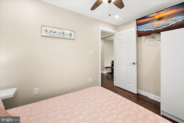 a bathroom with a granite countertop sink a mirror and a shower