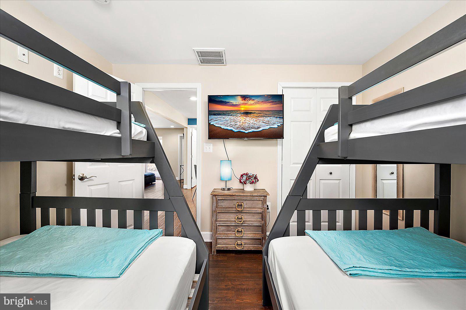 10428 Exeter Road Ocean City, MD 21842 - Photo 36 of 56 a living room with furniture and a flat screen tv