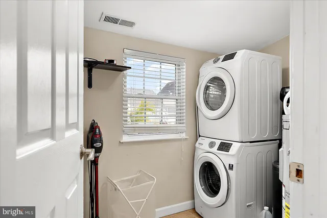 a view of a chairs and table in the patio