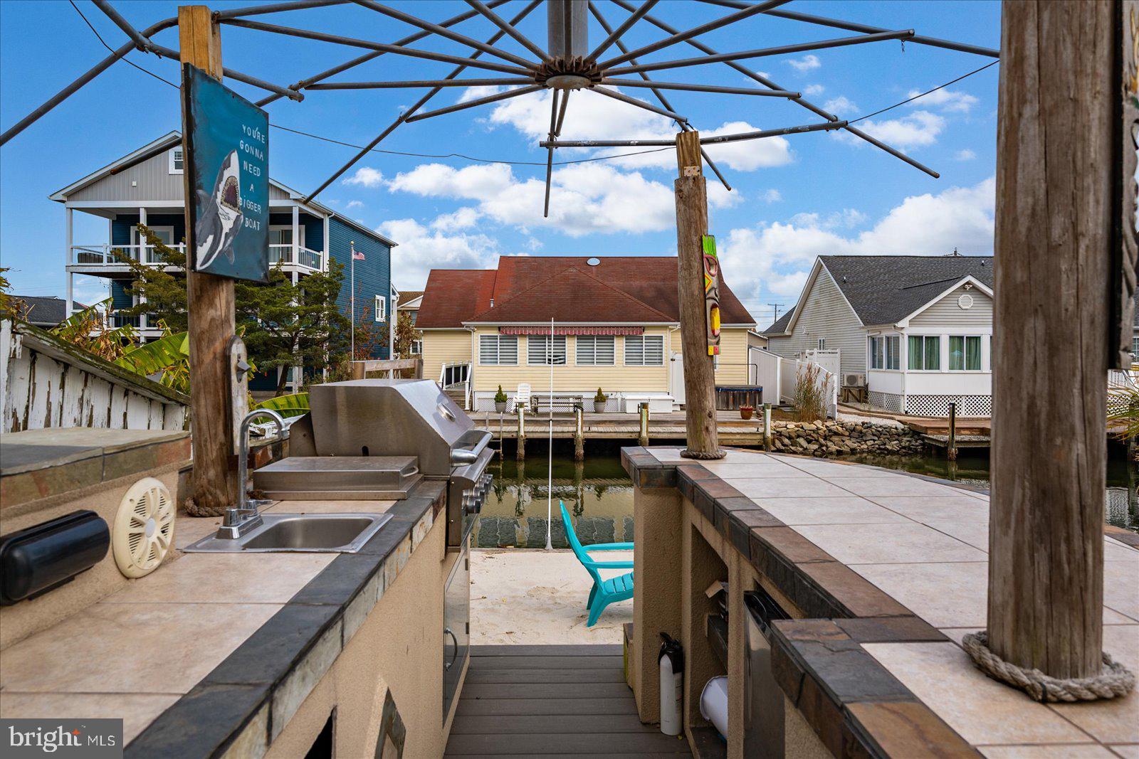 10428 Exeter Road Ocean City, MD 21842 - Photo 41 of 56 a view of a patio with swimming pool table and chairs