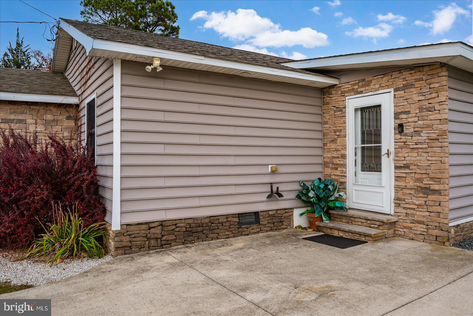 10428 Exeter Road Ocean City, MD 21842 - Photo 50 of 56 a view of a house with backyard and plants