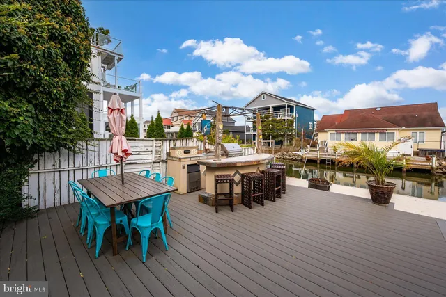 a front view of house with yard and trees around