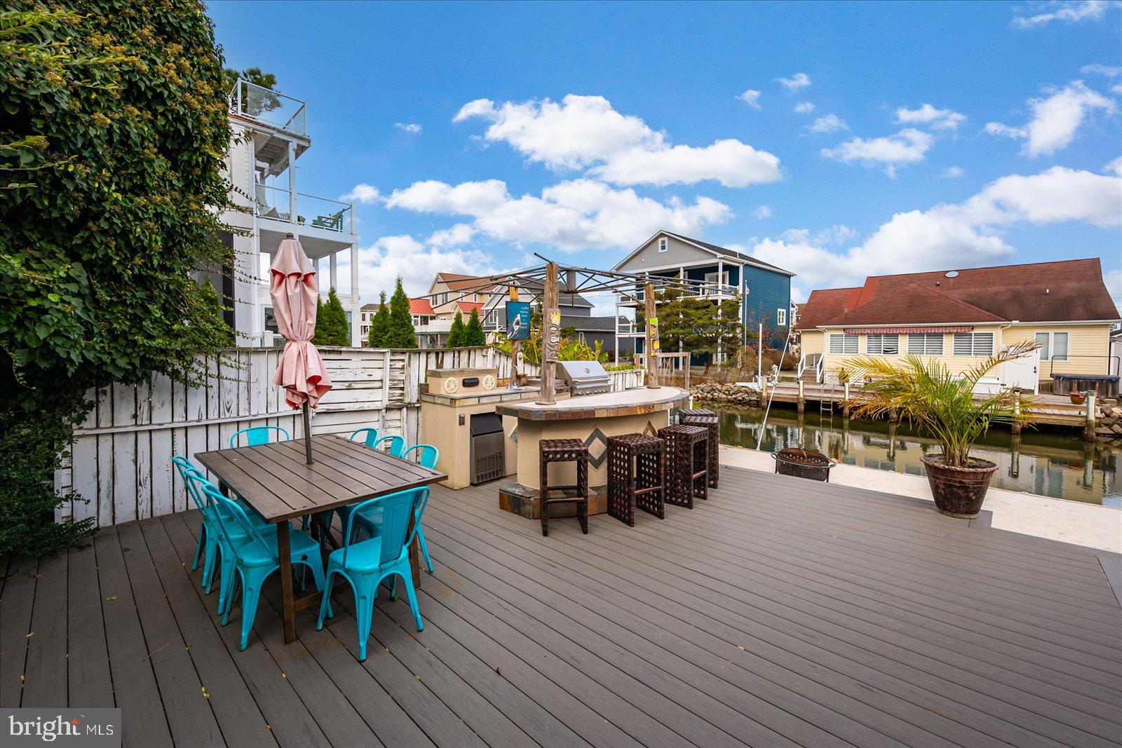 10428 Exeter Road Ocean City, MD 21842 - Photo 6 of 56 a view of a dinning table and chairs in the roof deck