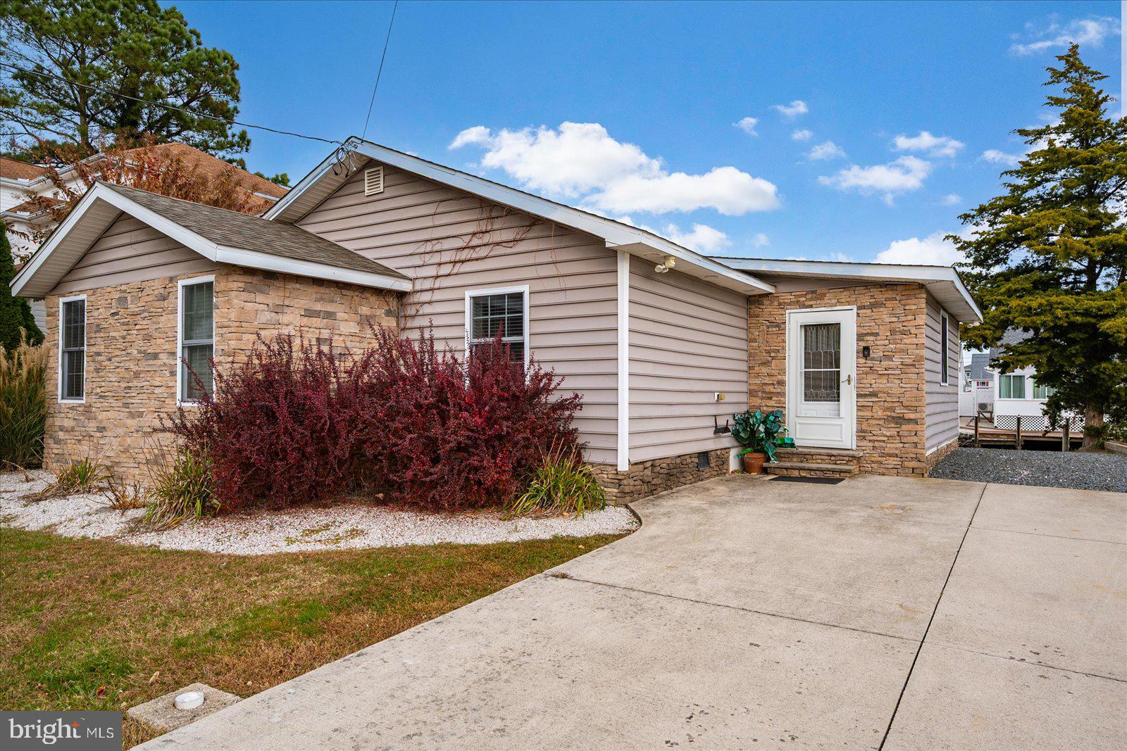 10428 Exeter Road Ocean City, MD 21842 - Photo 7 of 56 a front view of house with yard and trees around