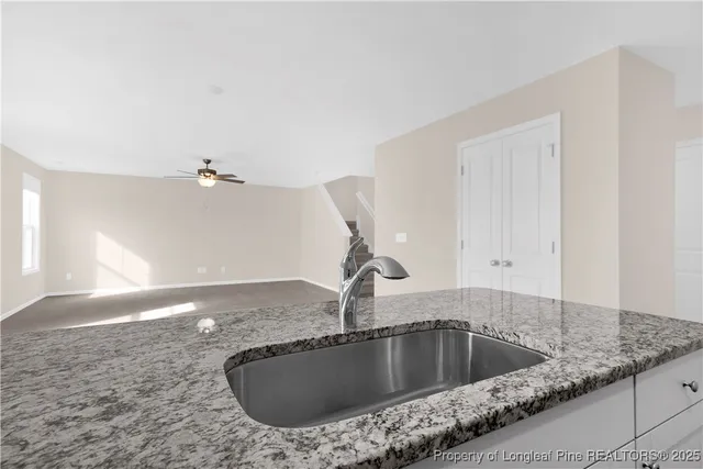 a kitchen with a sink and vanity