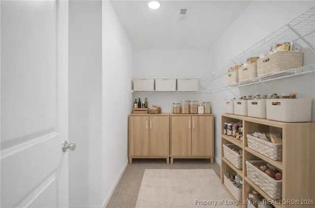 a kitchen with cabinets and window