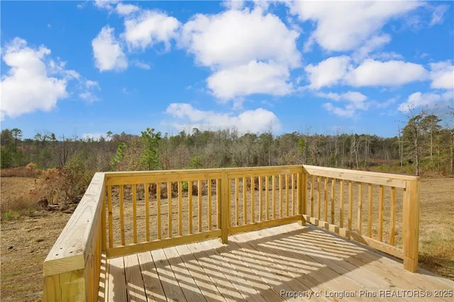 a view of a balcony with wooden fence