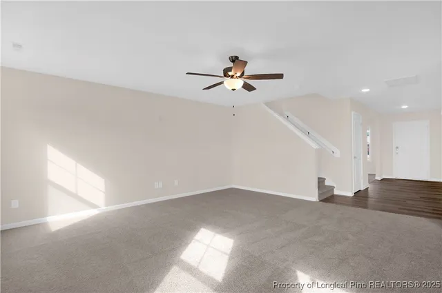 a view of a big room with carpet