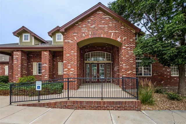a view of a patio with a table and chairs