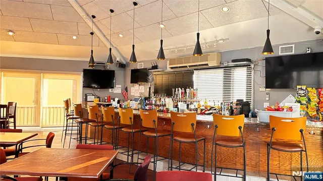 a view of a living room and dining room