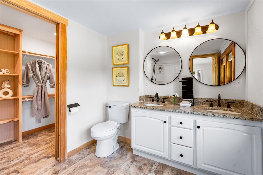356 Hunt Road Oakham, MA 01068 - Photo 18 of 42 a bathroom with a toilet a sink and a mirror