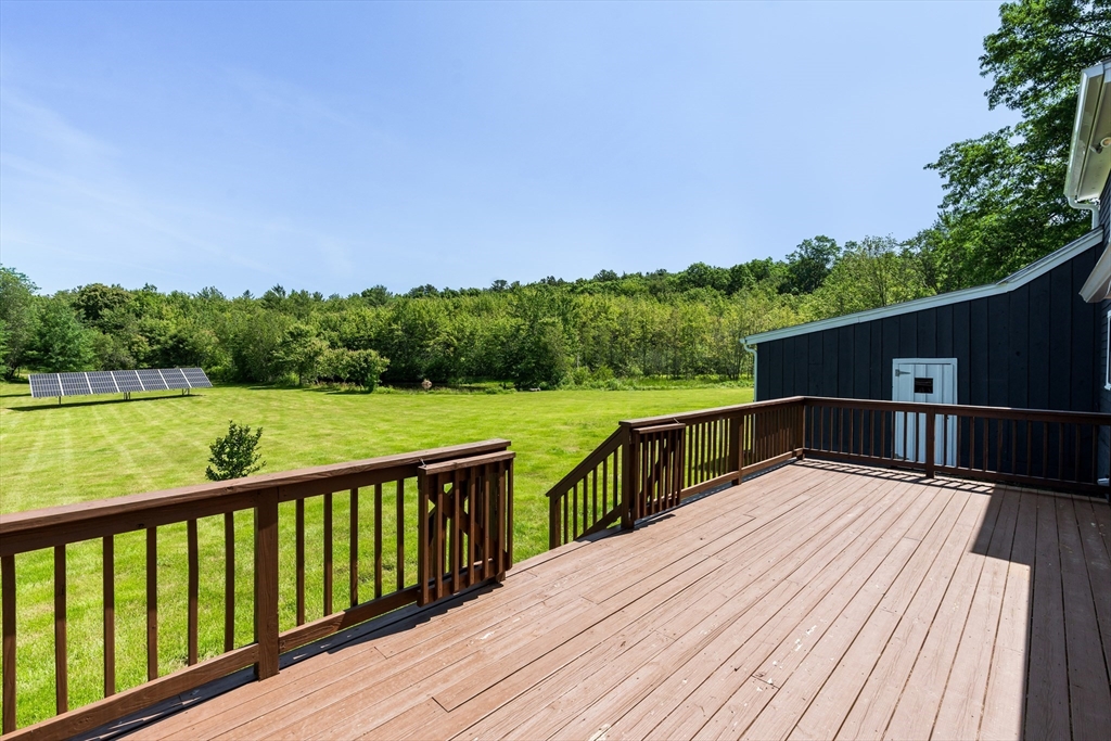 356 Hunt Road Oakham, MA 01068 - Photo 33 of 42 a view of balcony with deck and yard
