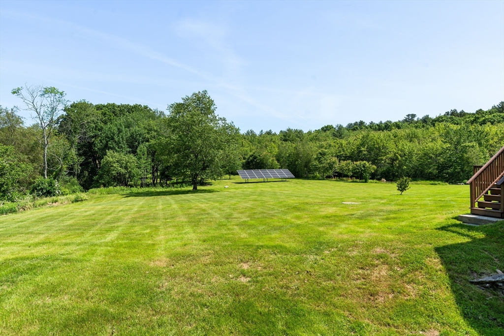 356 Hunt Road Oakham, MA 01068 - Photo 34 of 42 a view of a yard with a house