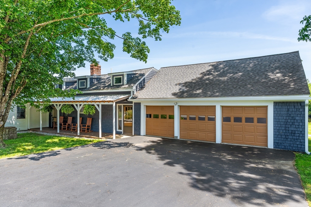 356 Hunt Road Oakham, MA 01068 - Photo 40 of 42 front view of a house with a garden
