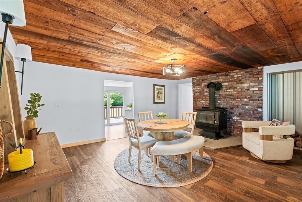 356 Hunt Road Oakham, MA 01068 - Photo 7 of 42 a dining room with furniture and wooden floor