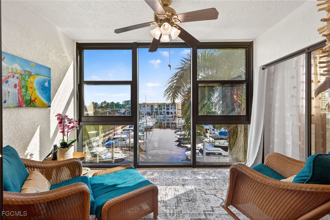 801 River Point Drive, Unit 203A Naples, FL 34102 - Photo 1 of 32 a living room with furniture and a window