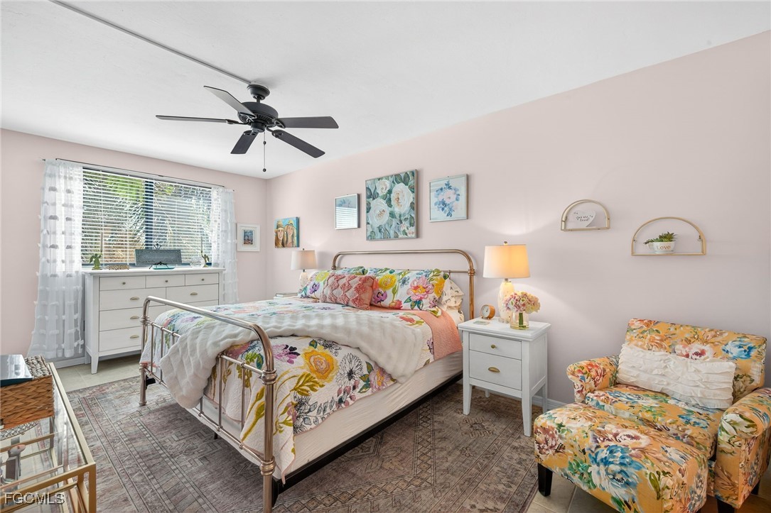 801 River Point Drive, Unit 203A Naples, FL 34102 - Photo 13 of 32 a bedroom with a bed and window