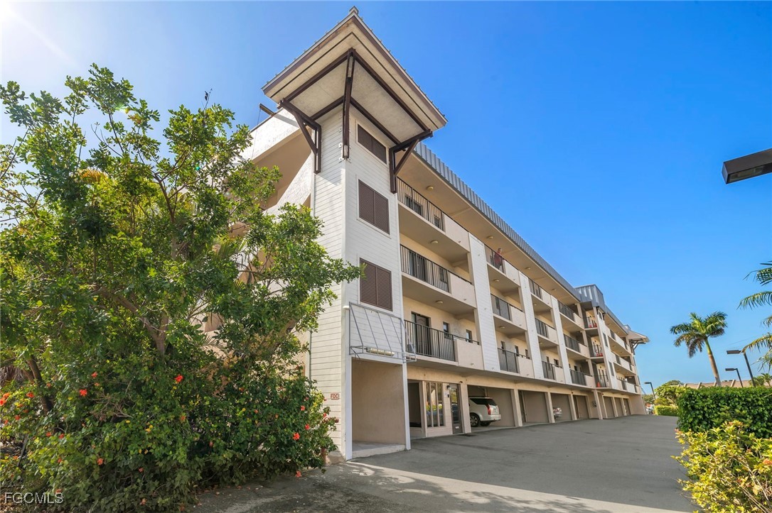 801 River Point Drive, Unit 203A Naples, FL 34102 - Photo 4 of 32 a front view of a building