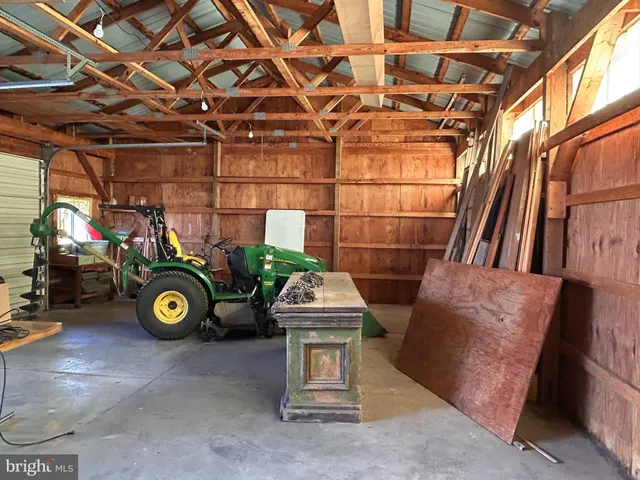 a view of a house with swimming pool and sitting area