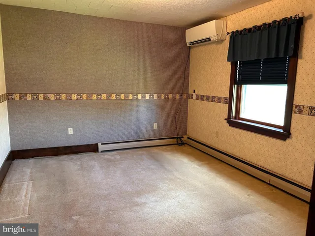 a view of small space with racks on the wall