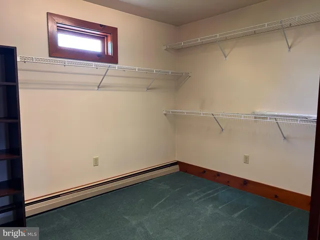 a view of a room with racks on the wall