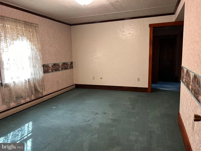 a bathroom with a toilet a sink and vanity