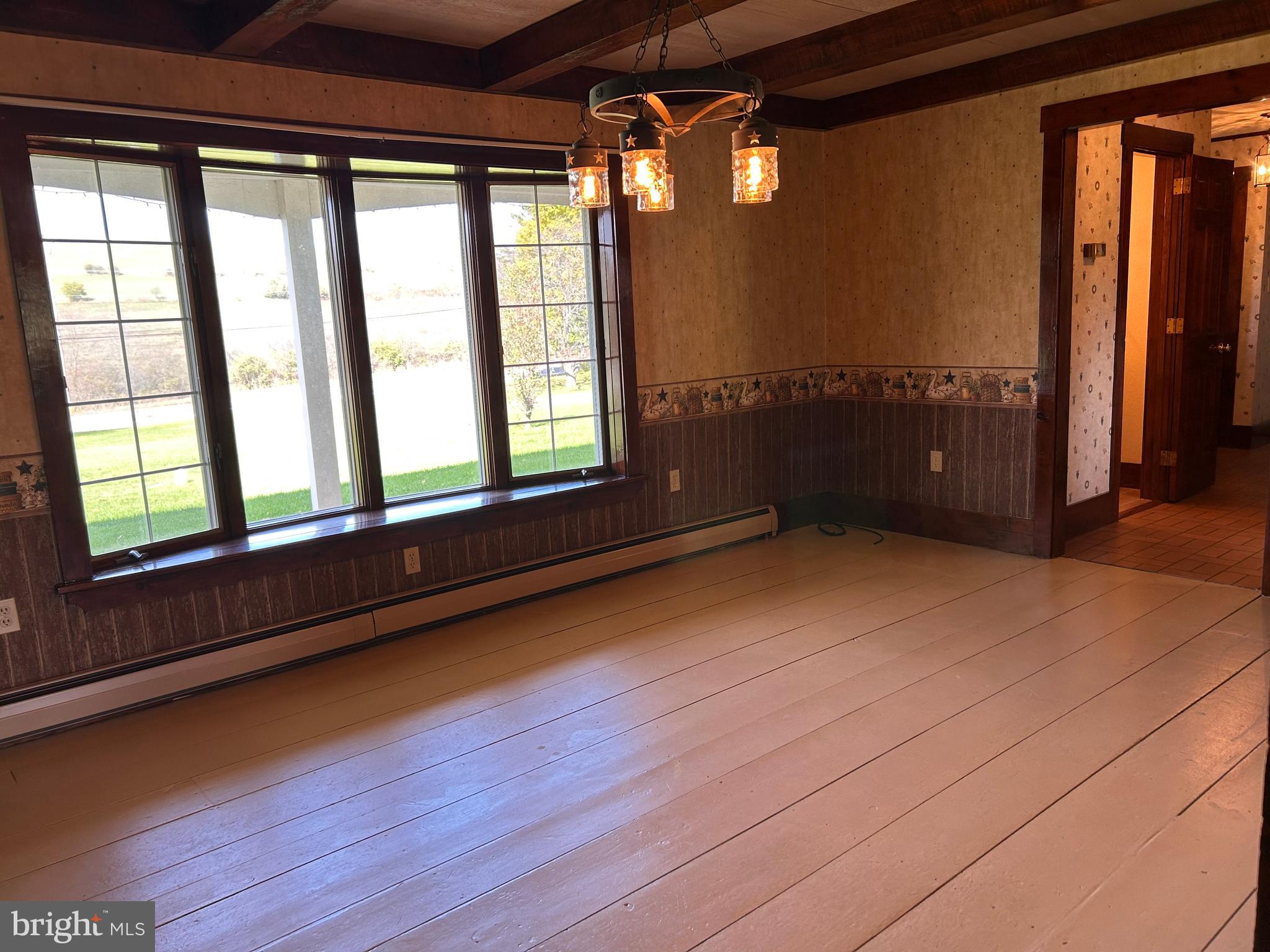 2068 Earlystown Road Centre Hall, PA 16828 - Photo 37 of 62 a view of an empty room with a window and wooden floor