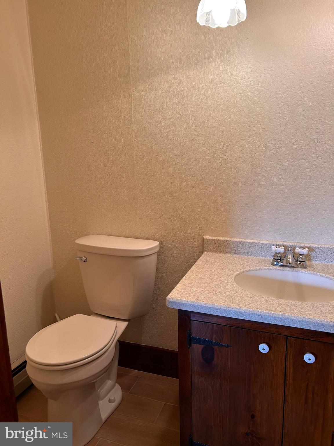 2068 Earlystown Road Centre Hall, PA 16828 - Photo 39 of 62 a bathroom with a toilet a sink and vanity