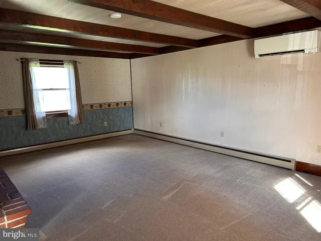 a view of a grassy field with an trees