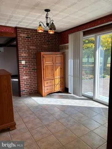 a view of a field with a tree