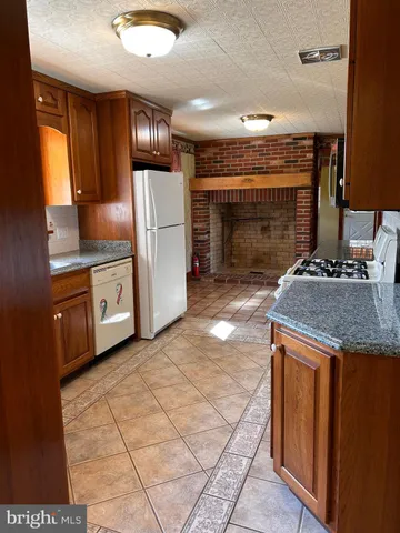 a huge green field with lots of trees