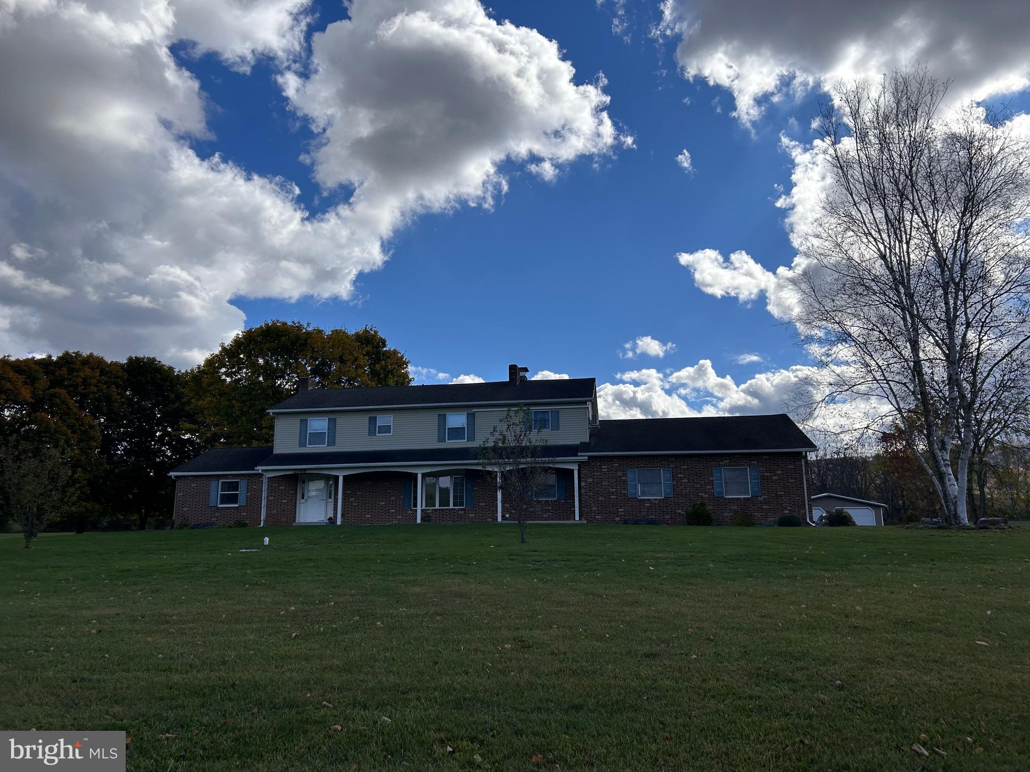 2068 Earlystown Road Centre Hall, PA 16828 - Photo 61 of 62 a front view of a house with a garden and yard