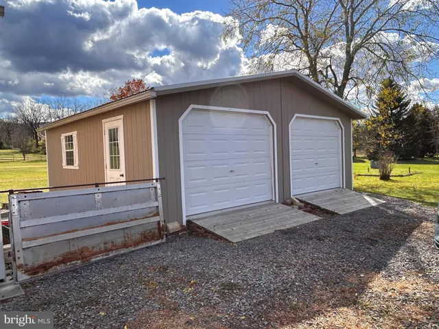 a front view of a building with seating space