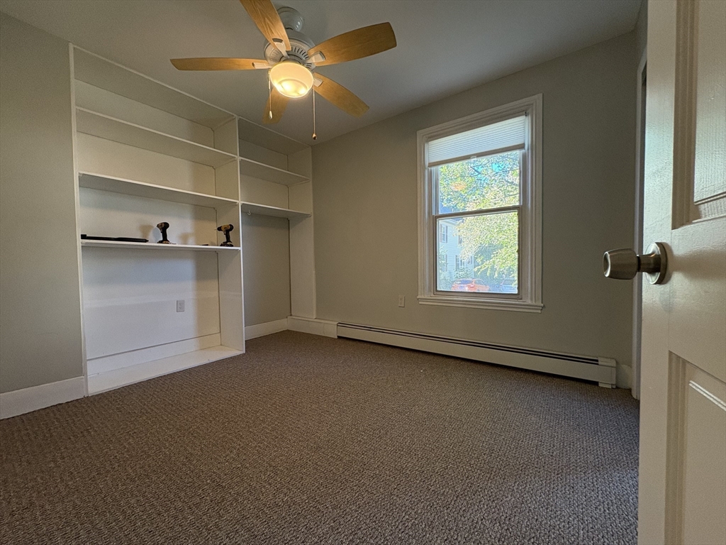 11 Franklin Street, Unit 1 Natick, MA 01760 - Photo 20 of 26 an empty room with a empty space and a window