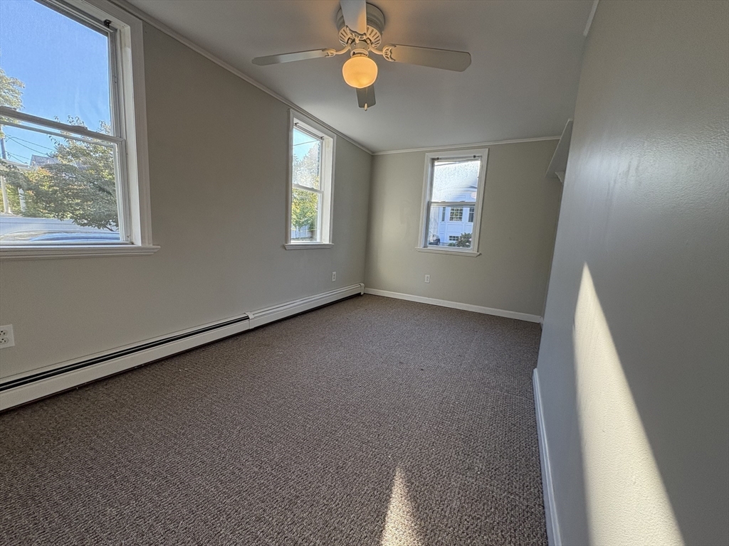 11 Franklin Street, Unit 1 Natick, MA 01760 - Photo 23 of 26 a view of a room with window and wooden floor