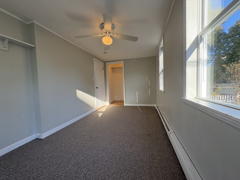 11 Franklin Street, Unit 1 Natick, MA 01760 - Photo 24 of 26 a view of an empty room with a window
