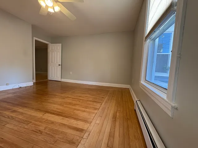 a view of wooden floor in an empty room