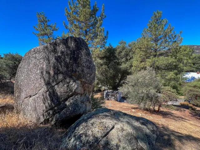 a view of a backyard of the house