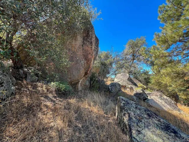 a view of a house with a mountain in the background