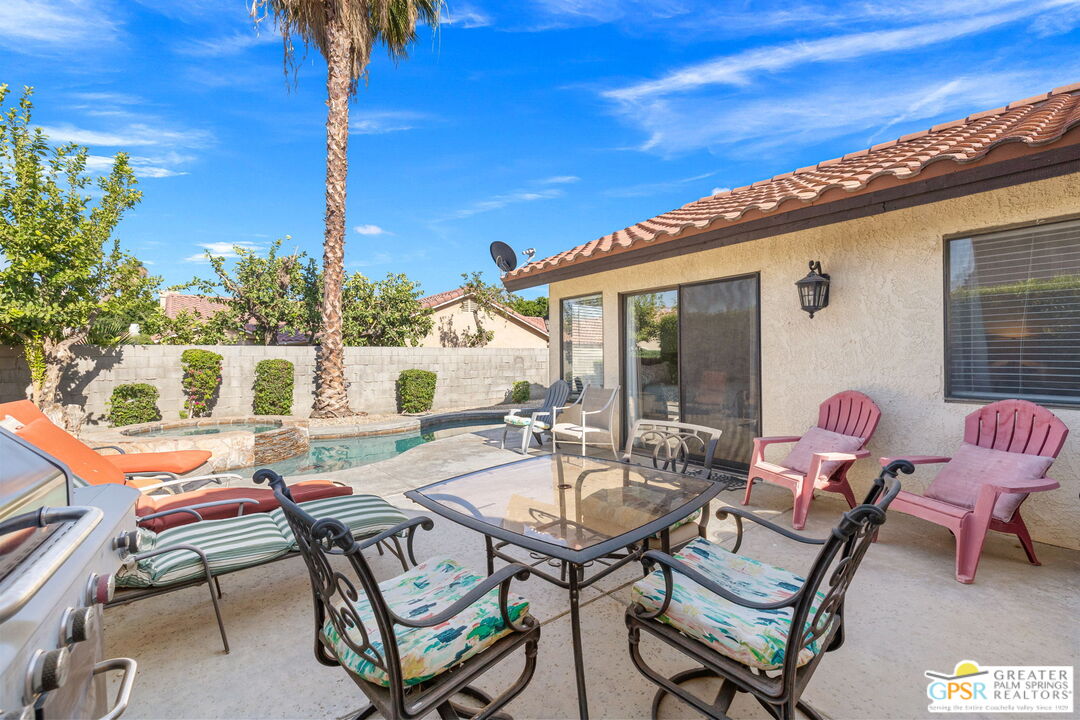 45688 Sutter Creek Road Indio, CA 92201 - Photo 3 of 51 a backyard of a house with table and chairs