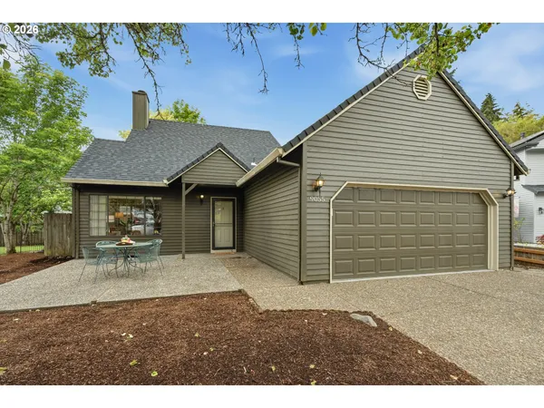 a house view with a outdoor seating space