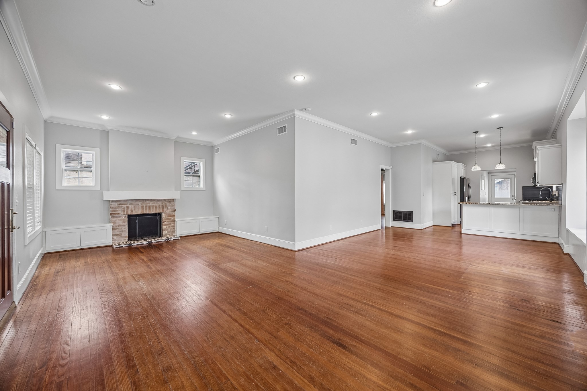 4412 Rusk Street Houston, TX 77023 - Photo 43 of 44 Open floor plan, high ceilings & gleaming original hardwood floors grace the living areas.